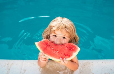 Photo for Child with watermelon in swimming pool. Kids eat summer fruit outdoors. Healthy children - Royalty Free Image