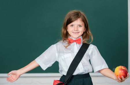 Photo for Little school girl student learning in class, study english language at school. Education, learning and children concept - Royalty Free Image
