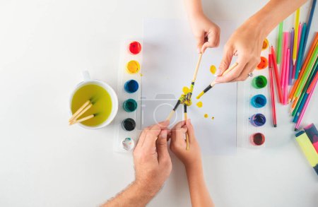 Foto de Humans hand is drawing with colorful pencils. Kids learning painting - Imagen libre de derechos