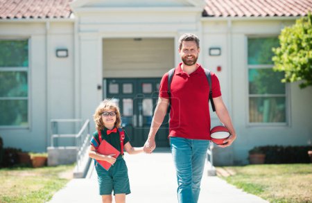 Photo for School boy going to school with father - Royalty Free Image