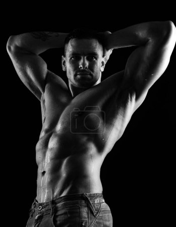 Photo for Naked muscular man in jeans. Nude male torso. Denim fashion. Sexy topless muscular fitnes model. Male naked body - Royalty Free Image