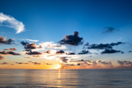 Photo for Sunrise sea on tropical beach. Landscape of beautiful beach. Beautiful sunset at sea. Colorful ocean beach sunrise with deep blue sky and sunrays - Royalty Free Image