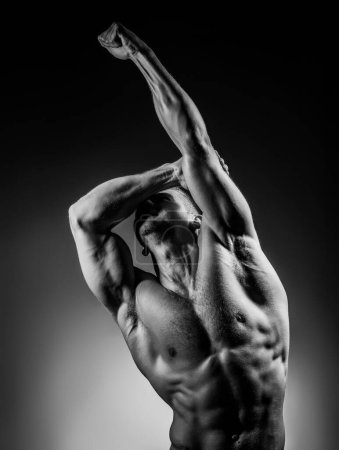 Photo for Man Power. Sexy muscular handsome topless male model. Muscular body. Muscular man. Male body shape, strong man. Athletic young man posing shirtless. Gay with naked torso. Muscular model - Royalty Free Image