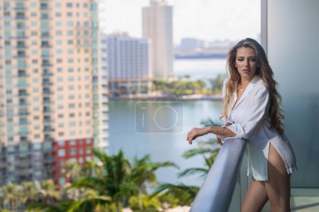 Photo for Sensual woman on morning at the balcony - Royalty Free Image