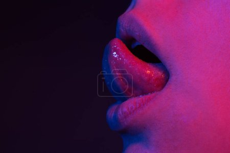 Photo for Licking suck tongue out. Sensual mouth. Woman tongue sensuality licking lips. Sensual sexy beautiful female mouth with tongue sticking out. Close up of woman sensual tongue. Lick, woman licking macro - Royalty Free Image