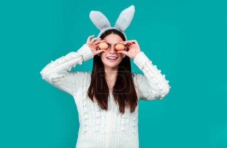 Photo for Easter girl. Funny woman wearing bunny ears and having fun with Easter eggs. Playing hunt eggs. Happy Easter concept - Royalty Free Image
