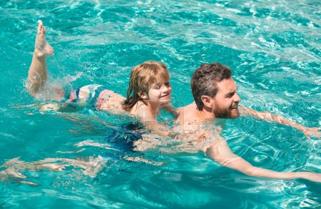Photo for Father and son swimming in pool, summer family holidays. Dad and son in pool. Swimming lessons. Fathers Day. Family weekend - Royalty Free Image
