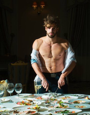 Man at restaurant. Diet guy with bare torso, choice between healthy and unhealthy food. Shirtless man food delicious. Assorted food on table. Dinner gourmet cuisine catering food concept