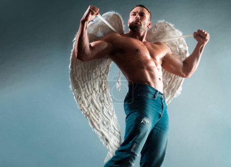 Photo for Muscular male model. Man with angels wings - Royalty Free Image