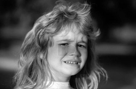 Photo for Closeup face of child boy crying outdoor. Kids cry. Boy cries of resentment and grief - Royalty Free Image