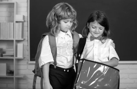 Téléchargez les photos : Back to school. Two little schoolkids. Education and friendship in school concept - en image libre de droit