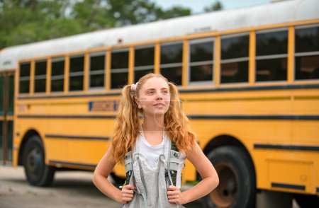 Photo for Teenager girl School concept. Teen scholars at school bus - Royalty Free Image