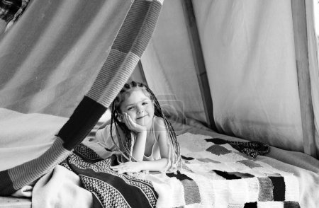 Photo for Child summer vacation concept. Kids camping. Having fun at campground outdoors. Boho kid lifestyle - Royalty Free Image