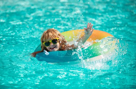 Photo for Kid in swimming pool. Boy at aquapark. Summer weekend. Summertime vacation - Royalty Free Image