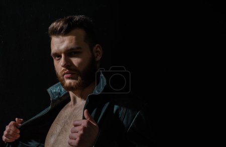 Photo for Fashion male model. Hipster style guy. Fashion man standing on black - Royalty Free Image