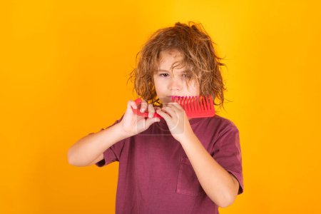 Photo for Morning kids after shower. Little child boy combing hair, isolated background - Royalty Free Image
