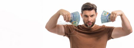 Photo for Business man hold money on white studio isolated background. Rich man in t-shirt with money dollar bills. Successful businessman with dollar banknotes. Rich millionaire in suit holding money, banner - Royalty Free Image