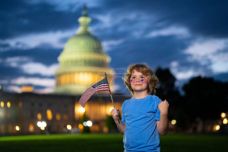 Photo for Election day for US Citizens. Child boy Vote with US flag near capitol building. Voting concept. American Flag Day. Vote and elections in US. American elections, president elections in America - Royalty Free Image
