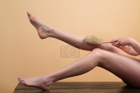 Photo for Legs care. Self legs massage. Cellulite on legs. Close up of a perfect female legs. Woman applying moisturizer. Hand With Natural Manicure Touching Sexy Long Leg - Royalty Free Image