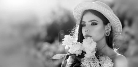 Photo for Natural beauty face. Beautiful woman enjoying spring, pretty girl relaxing outdoor, holding flowers, happy young lady and spring nature, harmony concept - Royalty Free Image