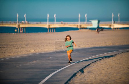 Photo for Boy kid running outdoor. Child are jump, run - Royalty Free Image