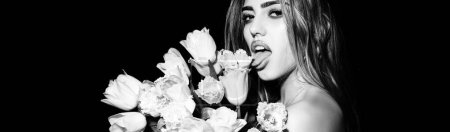 Photo for Spring woman face for banner. Sensual girl with tongue tulips. Blowjob kiss, sensual tongue licks a tulip flower. Sexy female mouth and spring flower. Isolated on black - Royalty Free Image