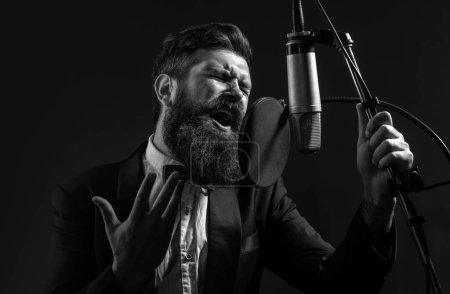 Singing man in a recording studio. Expressive bearded man with microphone. Karaoke signer, musical vocalist