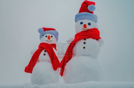 Snow man. Two snowman on snow background