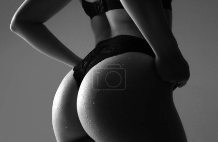 Photo for Sexy ass in erotic lingerie. Huge buttocks. Beauty butt with sensual touch - Royalty Free Image