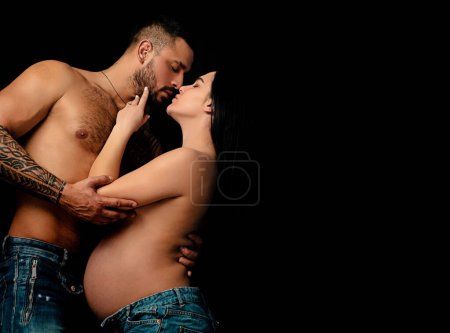 Photo for Young couple in love spends time together. Man embracing and going to kiss sensual woman - Royalty Free Image