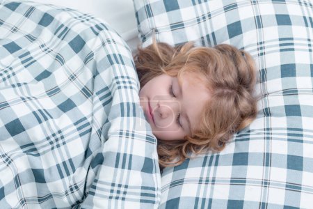 Photo for Little kid sleeps on bed, napping. Cute child sleeping - Royalty Free Image