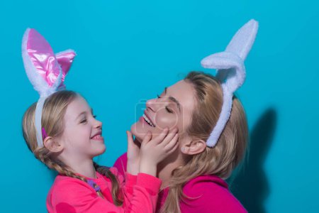 Photo for Easter Family traditions. Happy Easter Smiling mother and her daughter painting Easter eggs. Happy family preparing for Easter. Cute little child girl wearing bunny ears - Royalty Free Image
