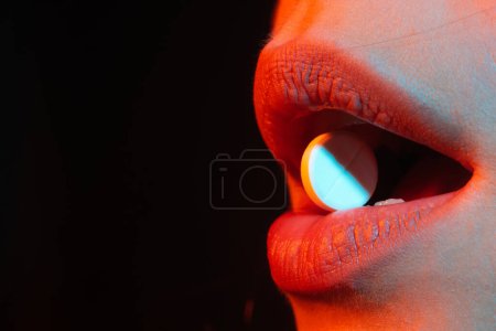 Photo for Pill in mouth close up. Woman taking pills, closeup. Sick ill woman holding antidepressant painkiller antibiotic pill. Take medicine. Female tongue with tablet pills. Lips holding pill in mouth - Royalty Free Image