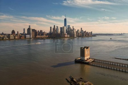 New York skyline from drone. New York over the Hudson river. Manhattan NYC cityscape, aerial view. New York Manhattan downtown skyline. New York skyscrapers over Hudson river