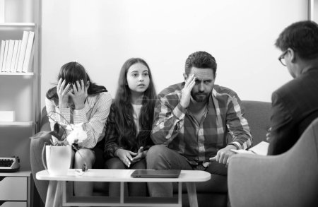 Photo for Family at psychology session. Psychological parents problem. Social worker psychologist talking to father mother and daughter teenage girl. Psychological parents problem, family therapy - Royalty Free Image