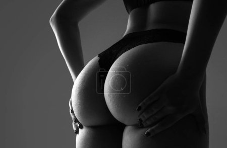 Foto de Fitness sexy form. Sexy ass in erotic lingerie. Perfect Female Buttocks slim figure, bikini thong underwear. Beauty butt with sensual touch - Imagen libre de derechos