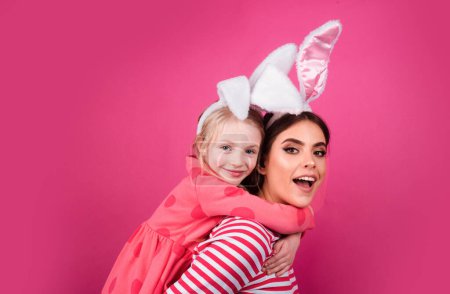 Happy easter family. Happy sister childhood concept. Girls bunny ears Funny little mother kids celebrate. Egg hunt traditional spring holiday