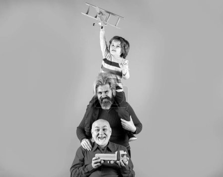 Photo for Grandfather father and son playing with toy plane. Happy man family. Three men generation. Happy childhood. Family man different ages. Family adventure, imagination and innovation inspiration concept - Royalty Free Image