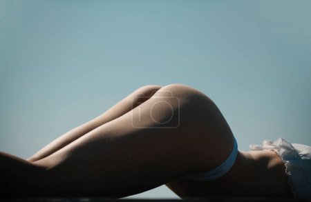 Foto de Body of sexy fit woman butt in erotic lingerie. Model in black lingerie. Big sexy ass. Sensual womans body. Female back and buttocks - Imagen libre de derechos