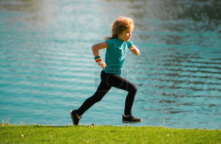 Photo for Child boy running outdoors. Child runner jogger running in the nature. Morning jogging - Royalty Free Image