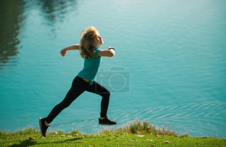 Photo for Kid runners in park. Little boy at athletics competition race. Young athlete in training. Runner exercising. Jogging for kids - Royalty Free Image