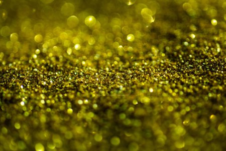 Photo for Abstract gold background of glowing lights in soft focus. Glitter golden backgrounds. Gold design. Glitter Gold backgrounds for valentines day, birthday or Christmas cards. Gold glitter background - Royalty Free Image