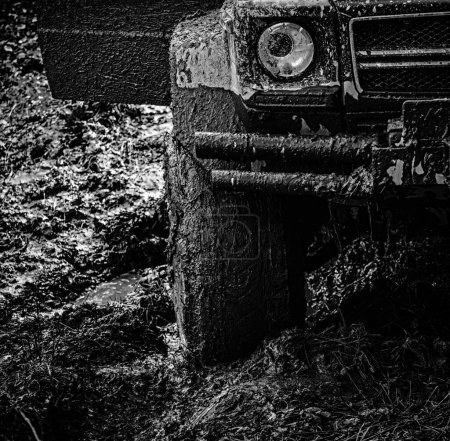 4x4 travel trekking. Offroad vehicle coming out of a mud hole hazard. Off-road travel on mountain road. Expedition offroader. Road adventure. Adventure travel