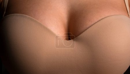 Lingerie model. Women breasts. Sexy breas, boobs in bra, sensual tits. Beautiful slim female body. Closeup of sexy girl boob in bra