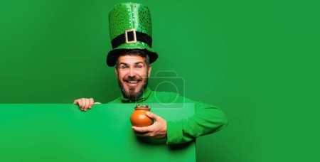 Lucky Patricks day. Happy St Patricks Day concept with pot of gold. Patricks board for Copy space. Patricks Day Pot of Gold and shamrocks. Banner or card