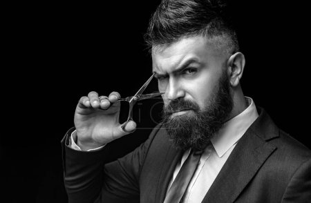 Scissors concept. Bearded man, bearded hipster. Stylish man beard. Barber scissors. Vintage barbershop, shaving. Long beard, caucasian hipster with moustache