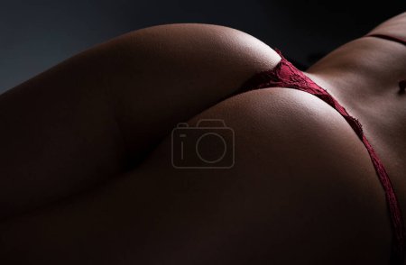 Foto de Sexy butt of sensual woman, buttocks in bikini, ass with thong lingerie closeup - Imagen libre de derechos