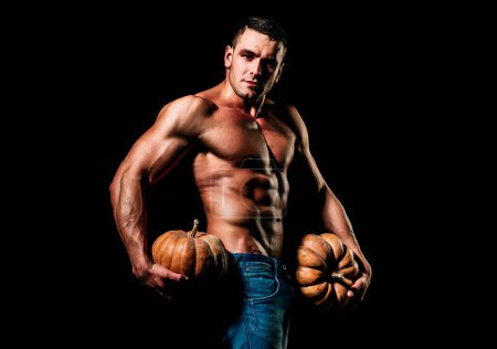 Photo for Halloween sale and shopping. Fashion guy with sexy naked torso hold pumpkin - Royalty Free Image