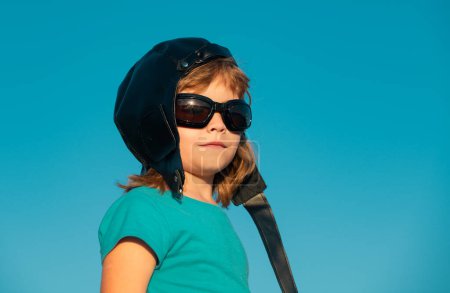 Photo for Kids with pilot helmet and glasses, close up head portrait of cute child. Kids dream - Royalty Free Image