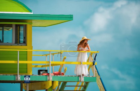 Photo for Young attractive girl with perfect body on the summer miami beach. Sexy woman on sea, sensual female model posing near ocean background with copy space - Royalty Free Image